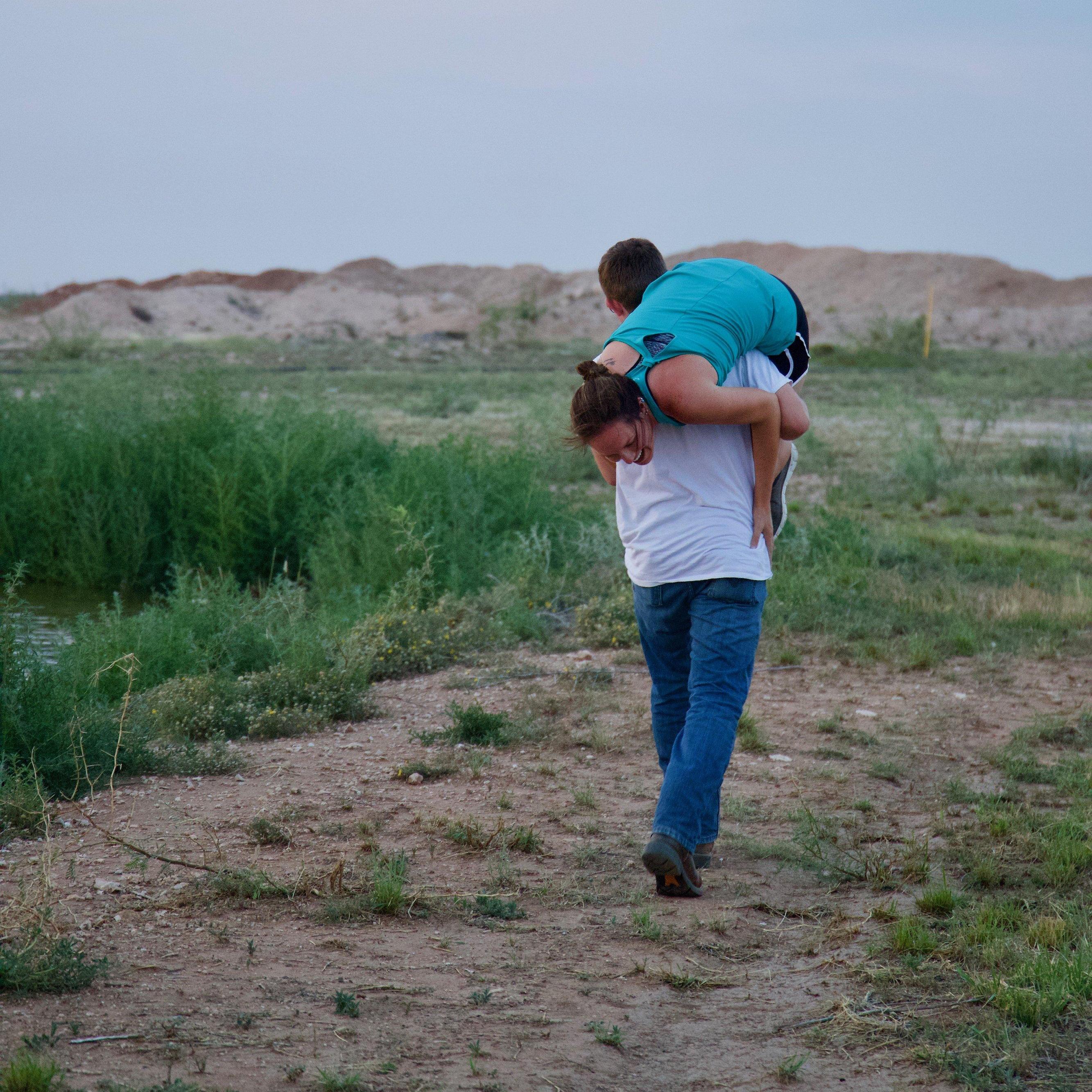 Kenny had to carry Becca away to ask her because she was distracted by all the people surrounding them!