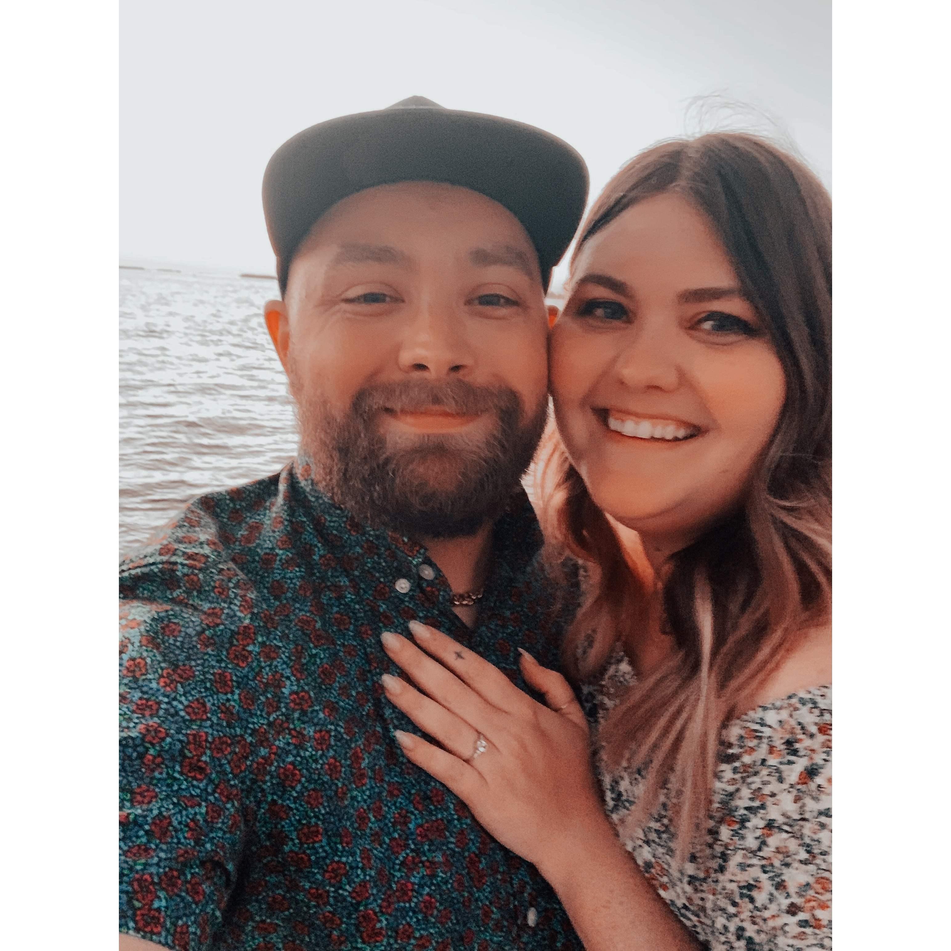 Moments after Jay popped the question! At the pier overlooking the beach in Cape Coral, Florida