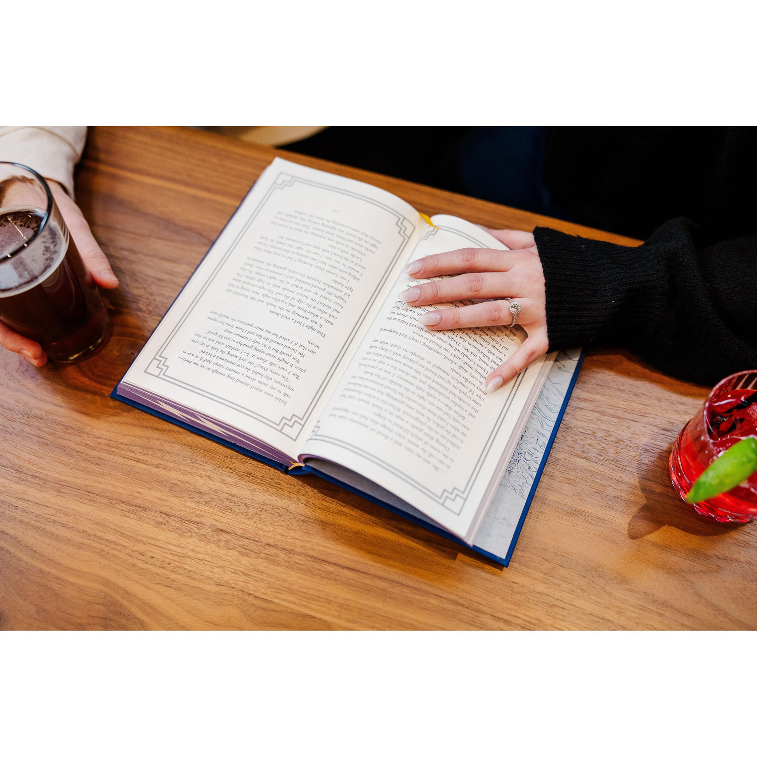 We share a love of reading and both grew up on the same stories, so naturally, we had to bring a prop along for our engagement photos.