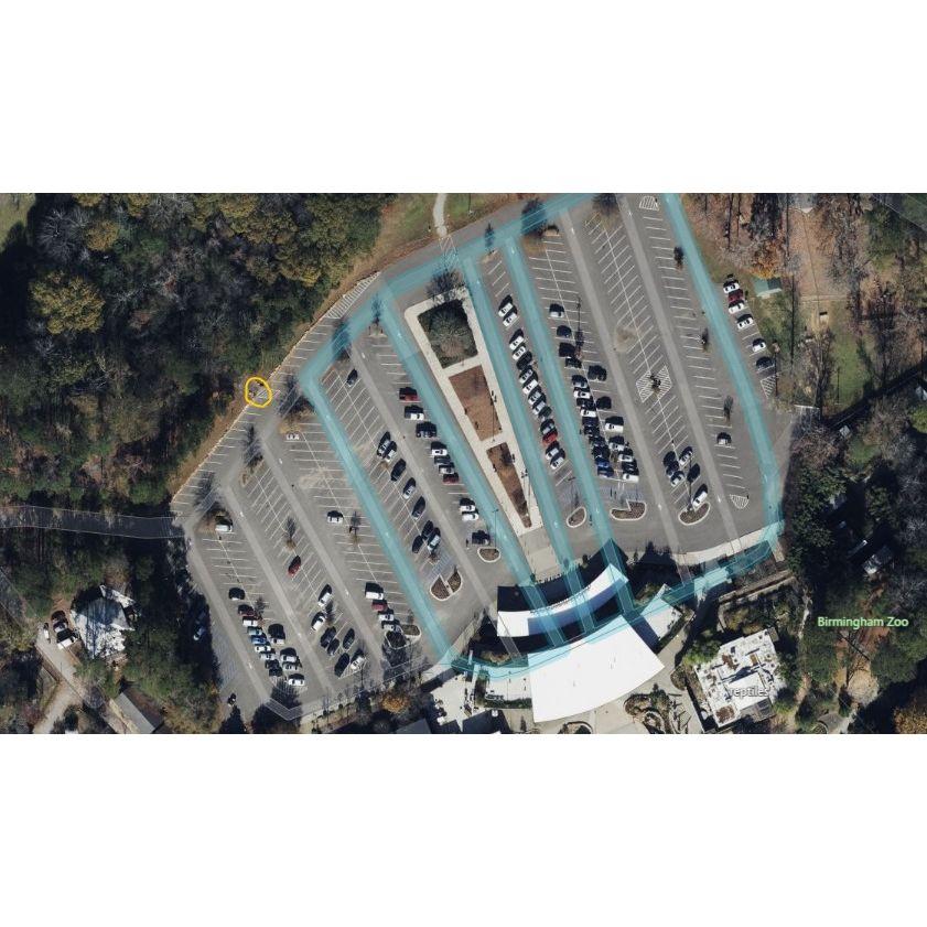 An aerial view of the Zoo's main parking lot. The yellow circle shows the entrance to the walking path.