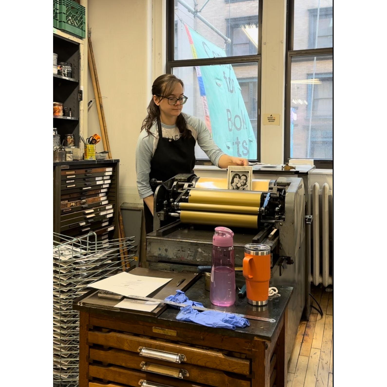 Liz letterpressing save the dates by hand at Center for Book Arts.