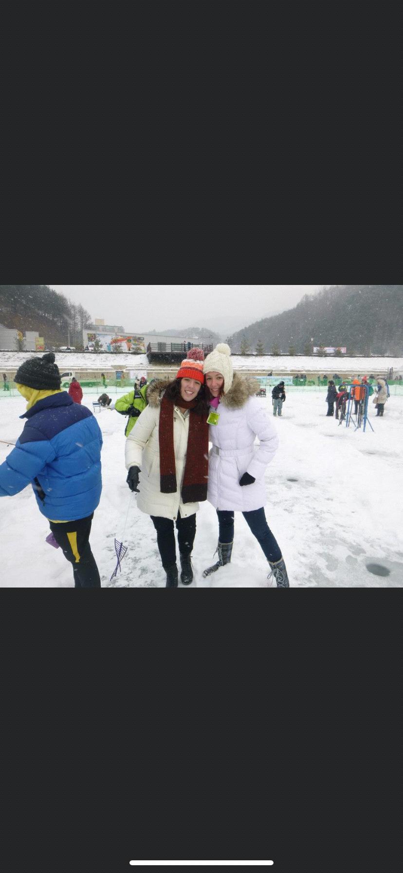 Meghan and sister Kelsey ice fishing in Korea