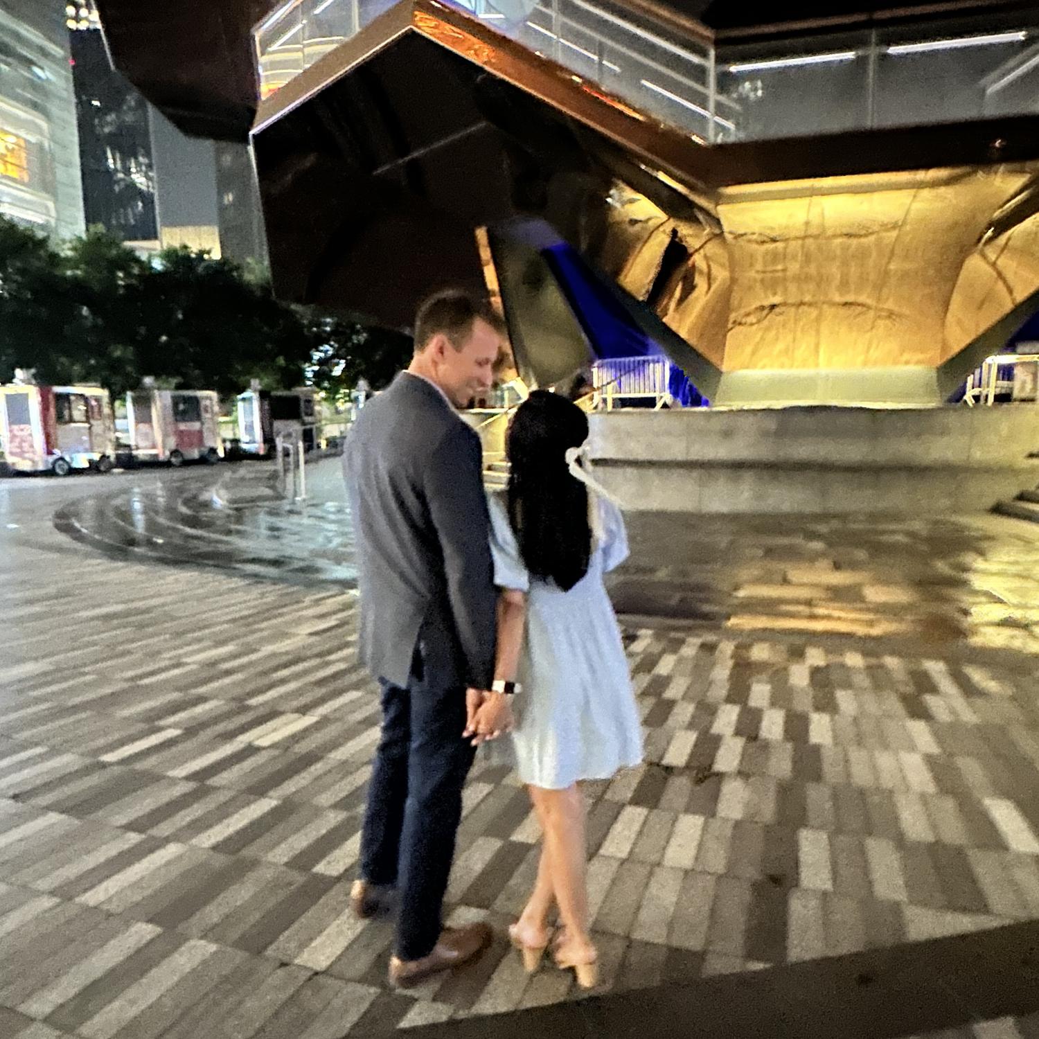 Trusting Nioz's phone to a random stranger to take a picture of us after our proposal. She really tried her best to take good photos lol
