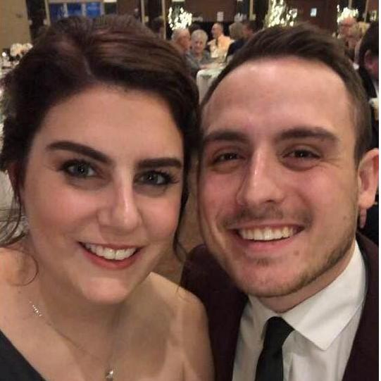 Brooke and Nick celebrating their best friend's wedding in Rochester, NY