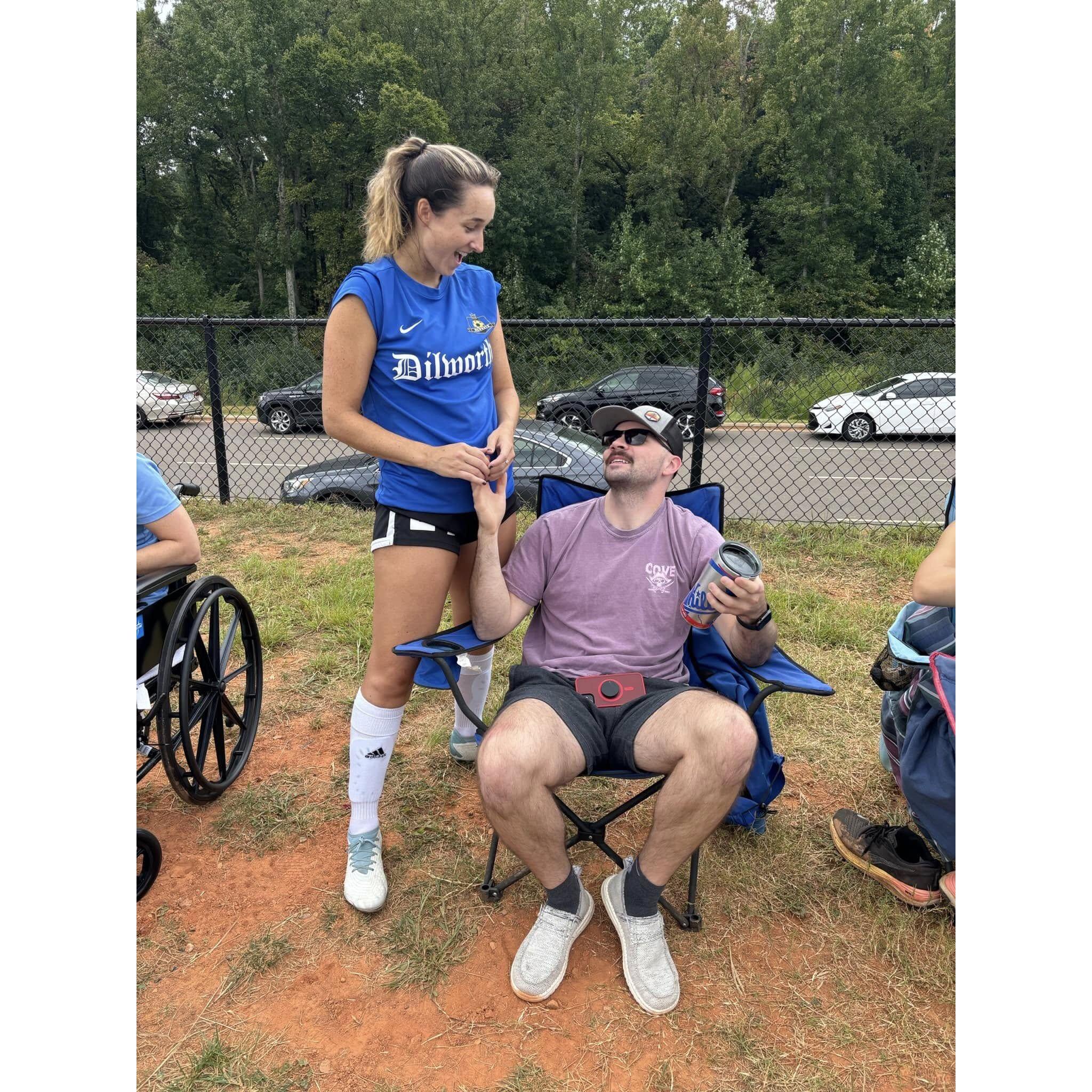 Pete cheering Becca on at her adult league soccer game.