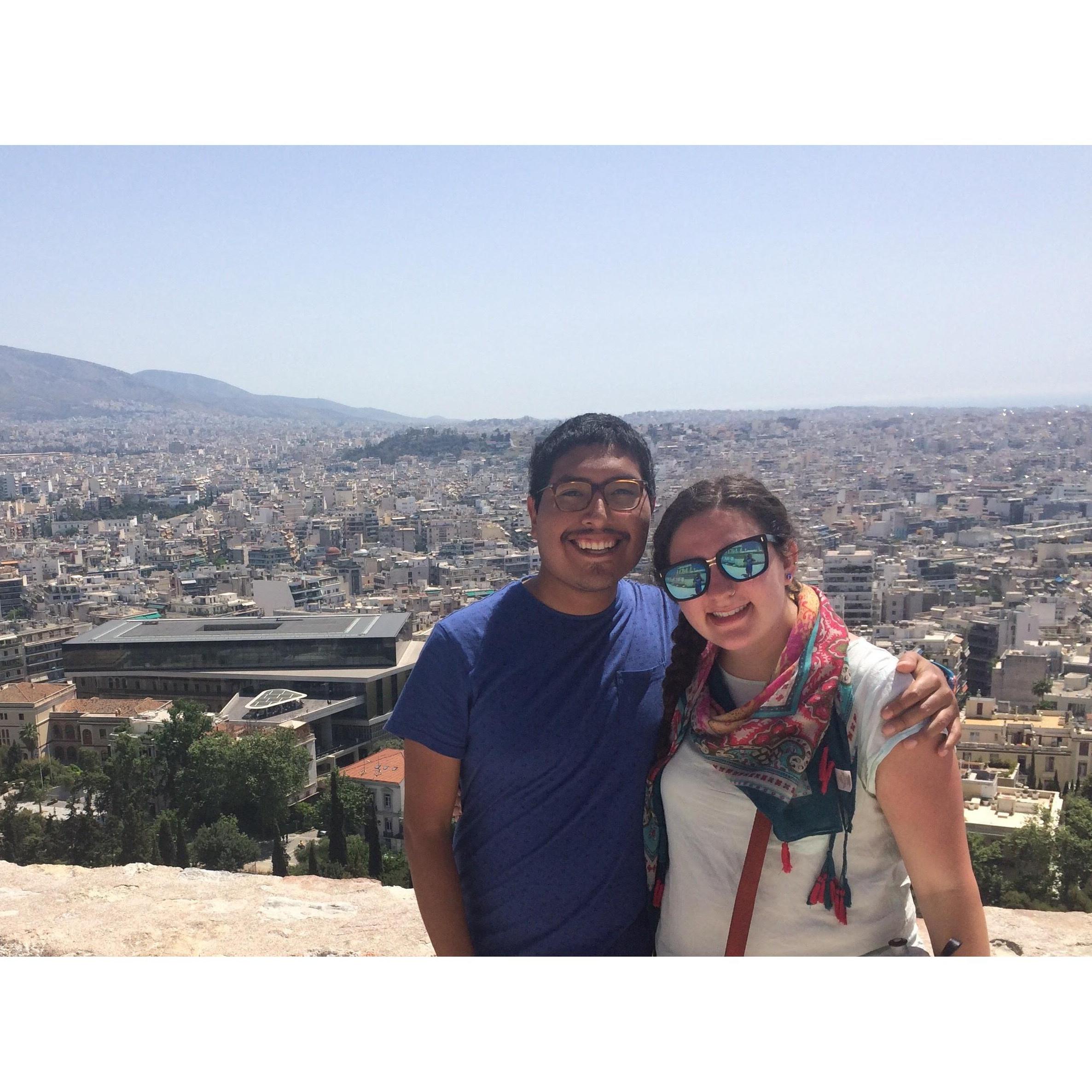Amanda and Jake in Athens, Greece, with a beautiful view of the Acropolis.