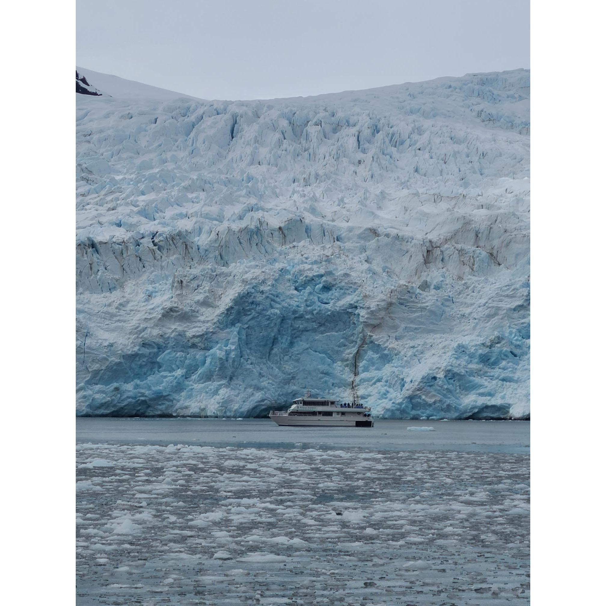 Look how tiny the boat is compared to the glacier.