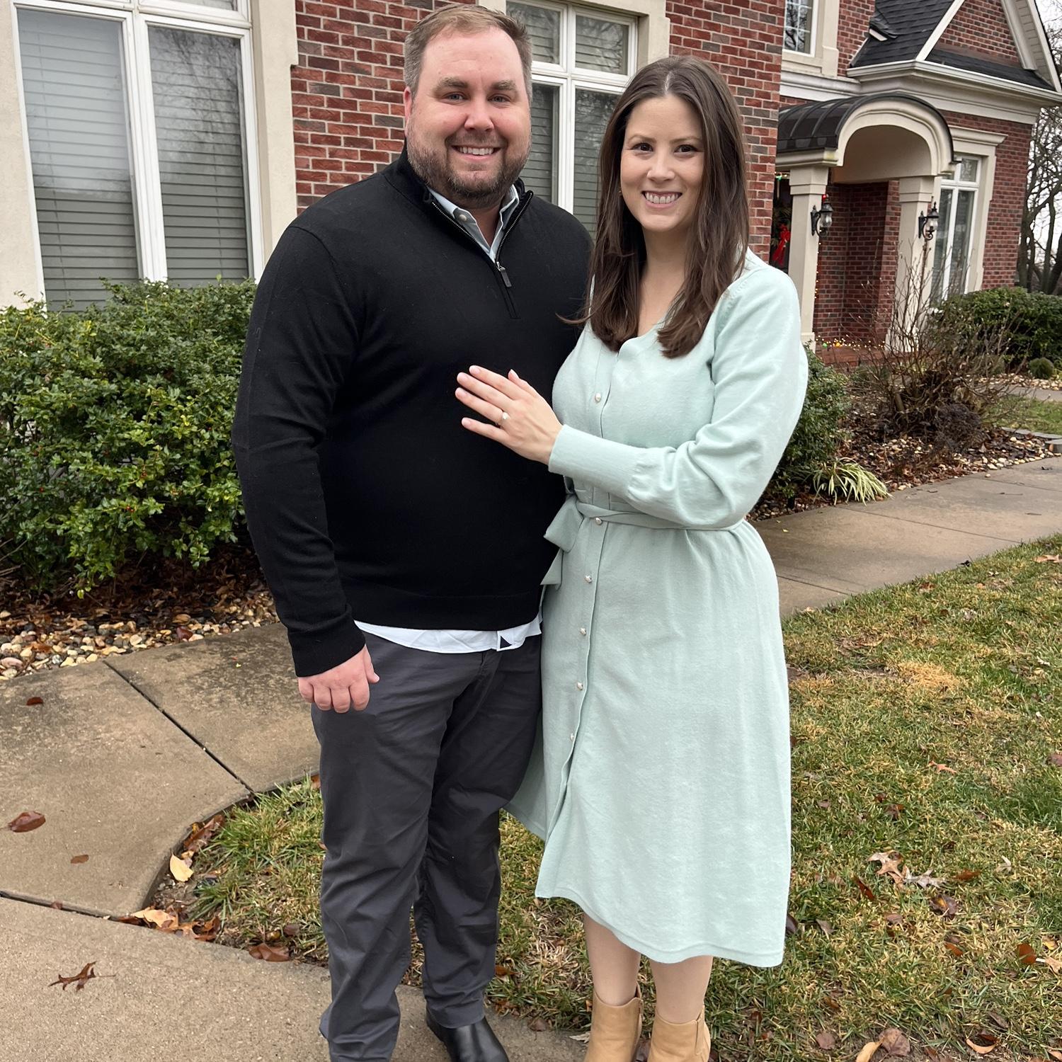 Posing for a photo on Christmas Eve right after we got engaged