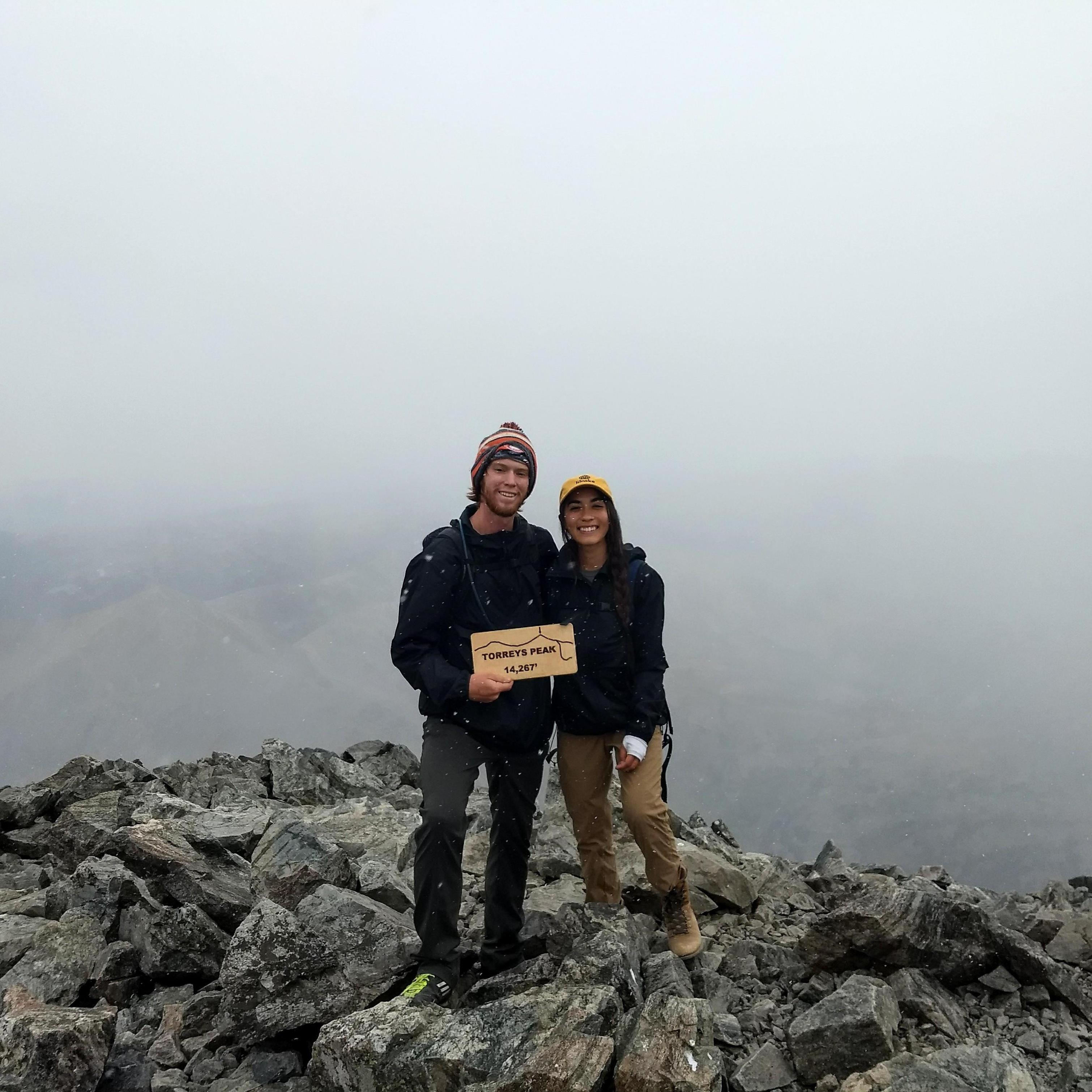 Standing at 14,267' on top of Torreys Peak, one of our early 14ers. We've now completed twelve peaks together!