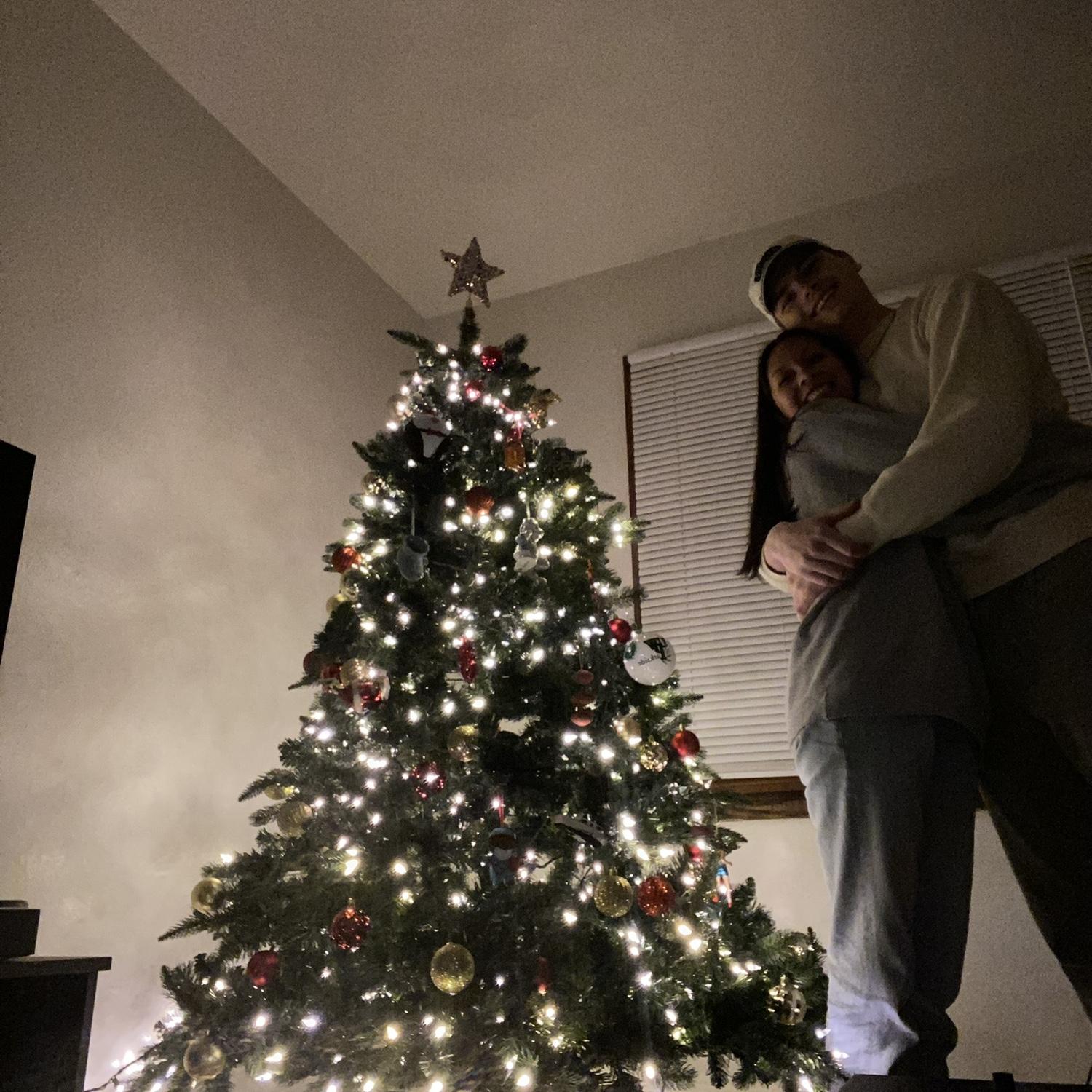 Decorating our first tree together, at Daisy’s first apartment.