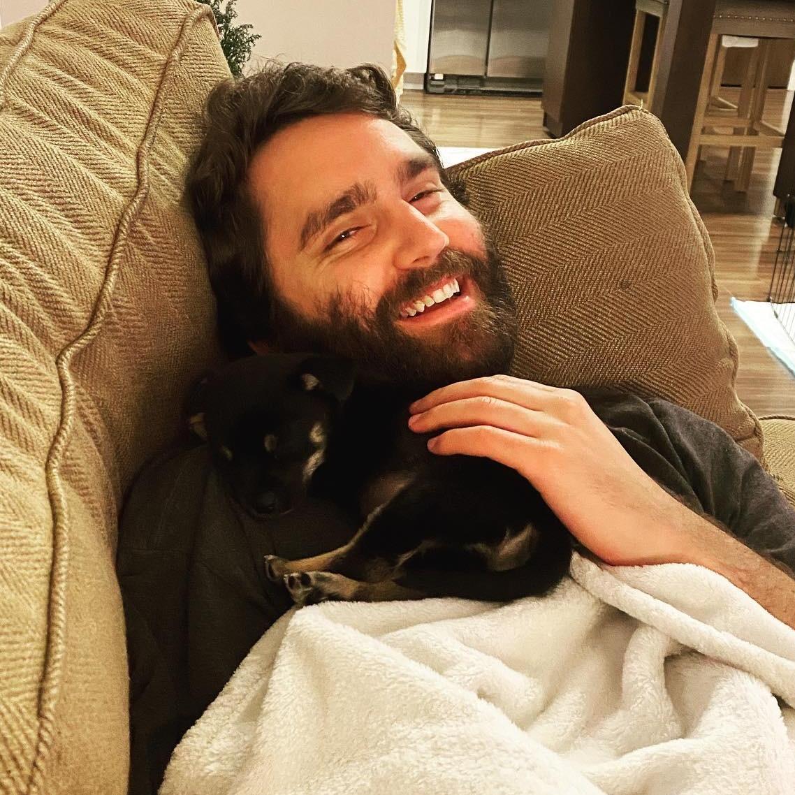 Alex with our rescue puppy Mookie, who we adopted on January 6, 2021.