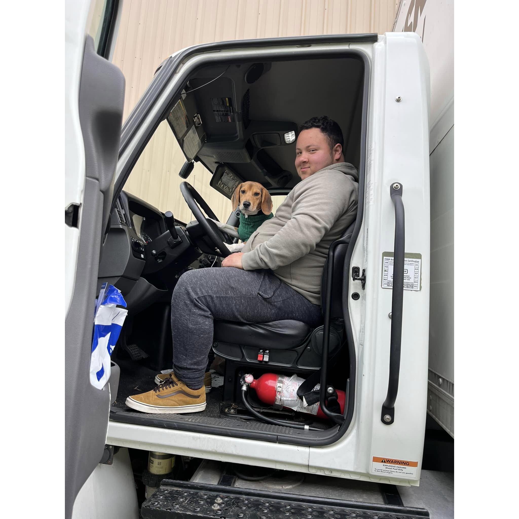 Isaac and Dexter enjoying the front seat of the moving truck when we made the big move up to PA—such a memorable moment!