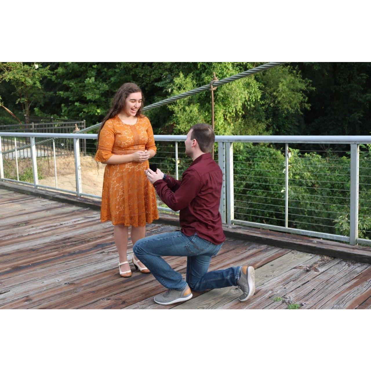 He popped the question on July 19! Photo creds:  Tiffany Burks