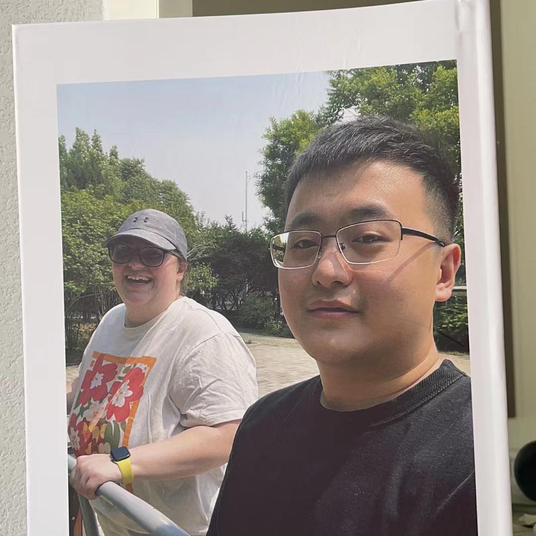 A photobook that Haonan made of their first adventures together in-person. Cover photo: playing on the exercise equipment in Beijing.