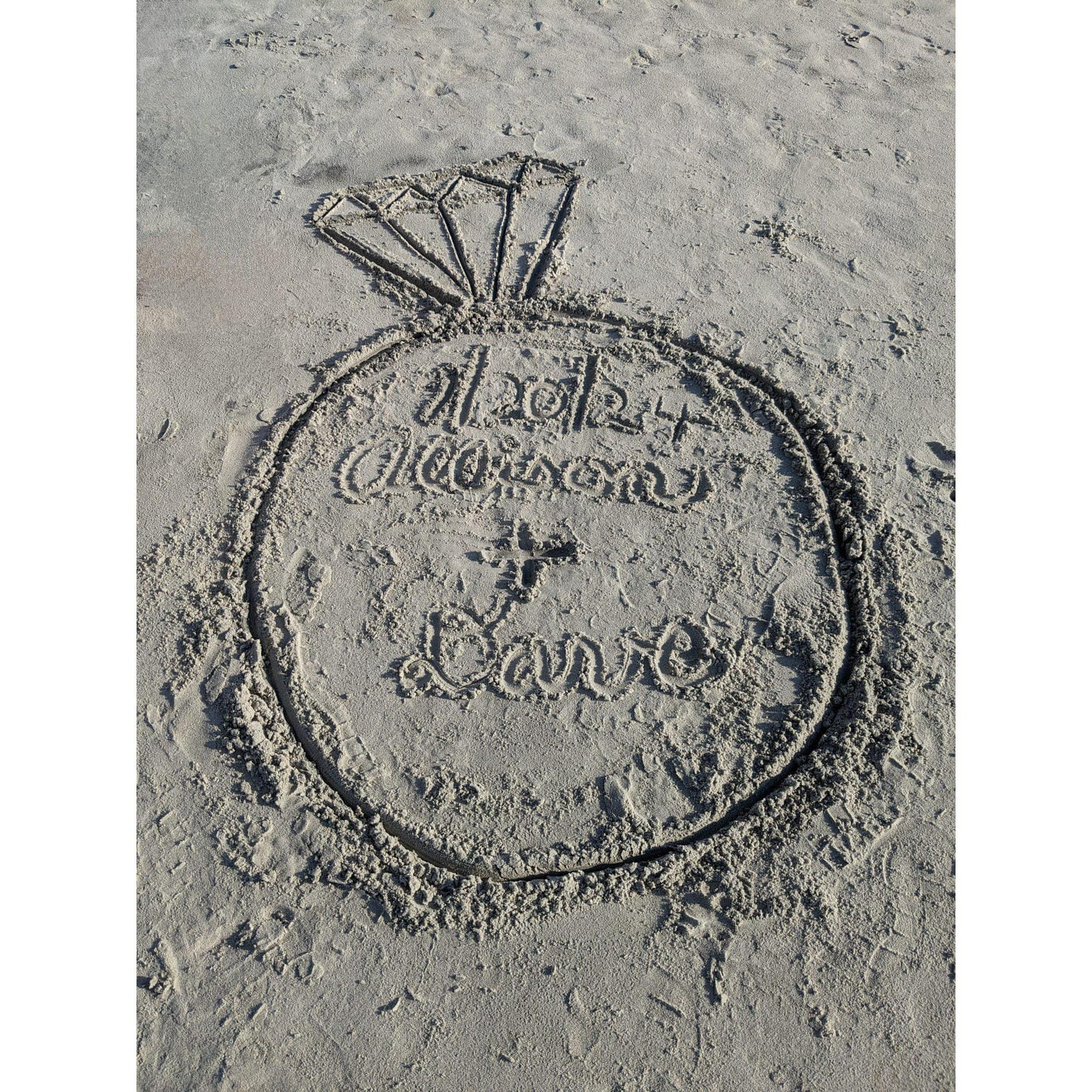 Dave's younger cousins made this fun sand art for them to discover on the shore as they walked back from their engagement.
