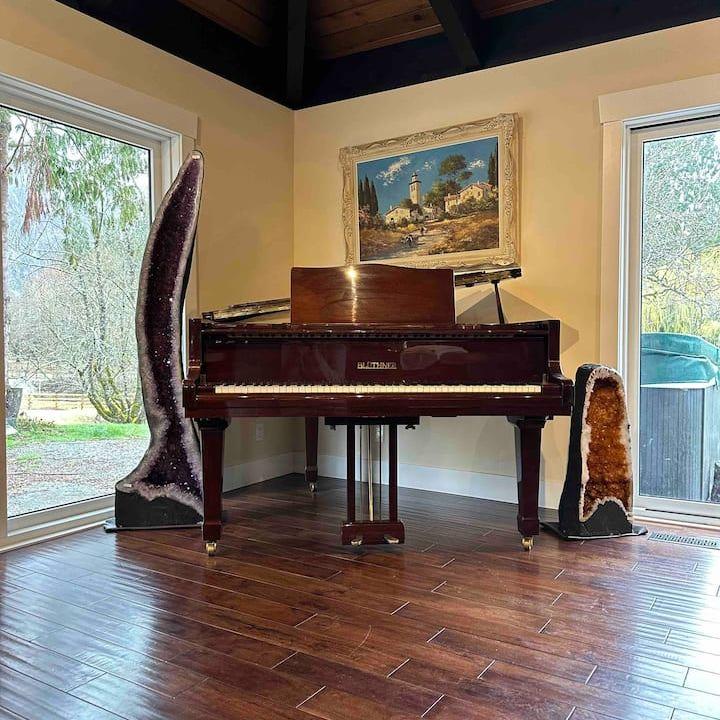 Grand piano, inside main house, available for open mic night!