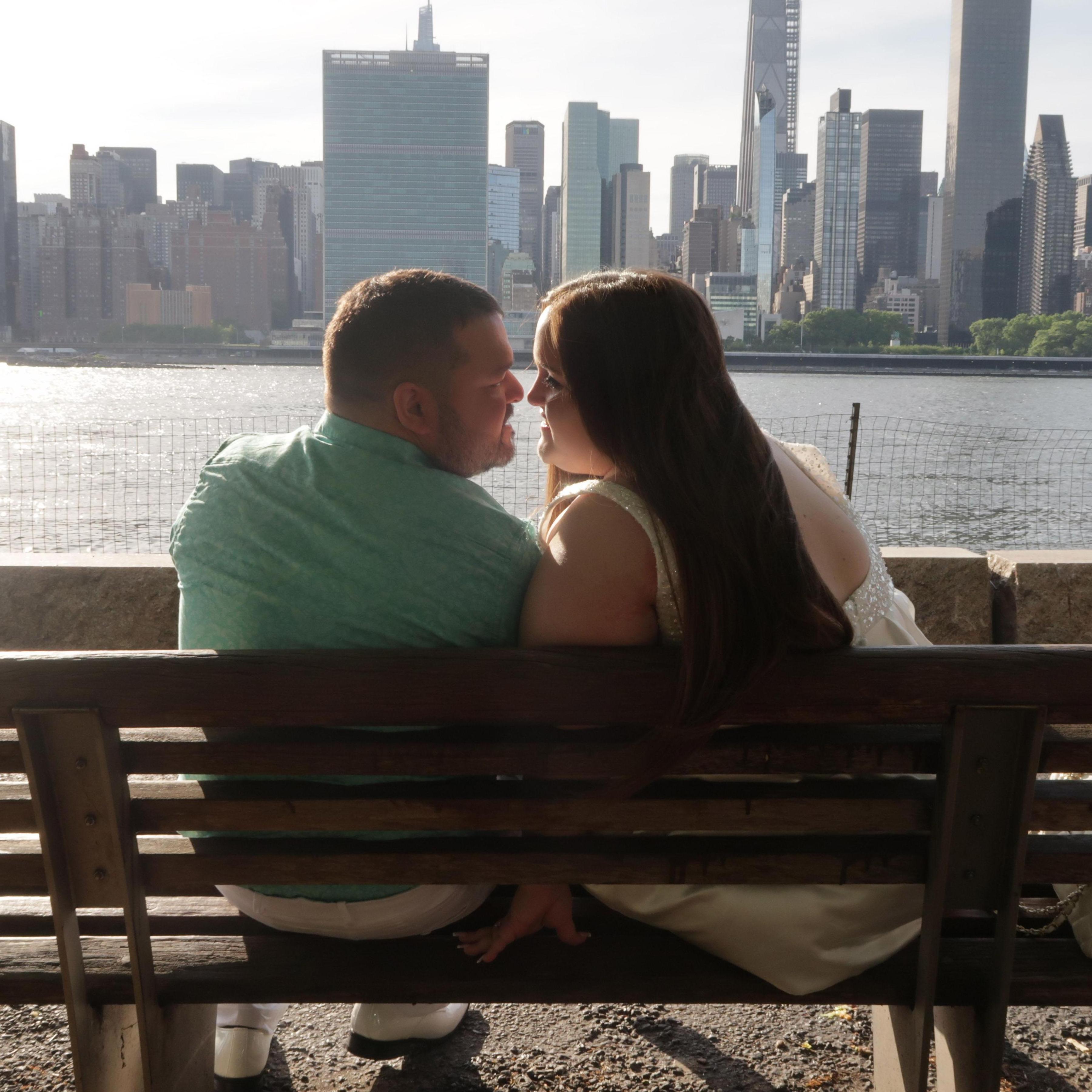 On a park bench in Long Island City.