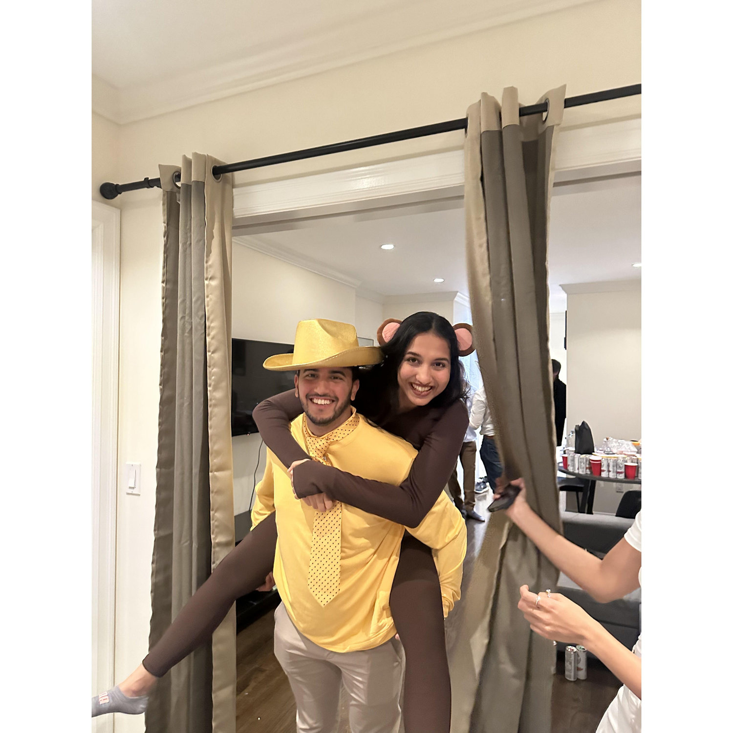 Dressing up as Curious George and the Man in the Yellow Hat for Halloween 2023