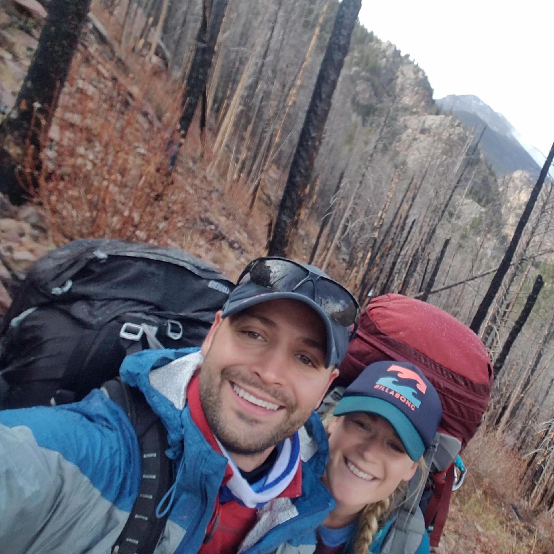 Our first trip together in Colorado - this was taken during a HUGE climb carrying our HUGE backpacks but we are still smiling (just)!