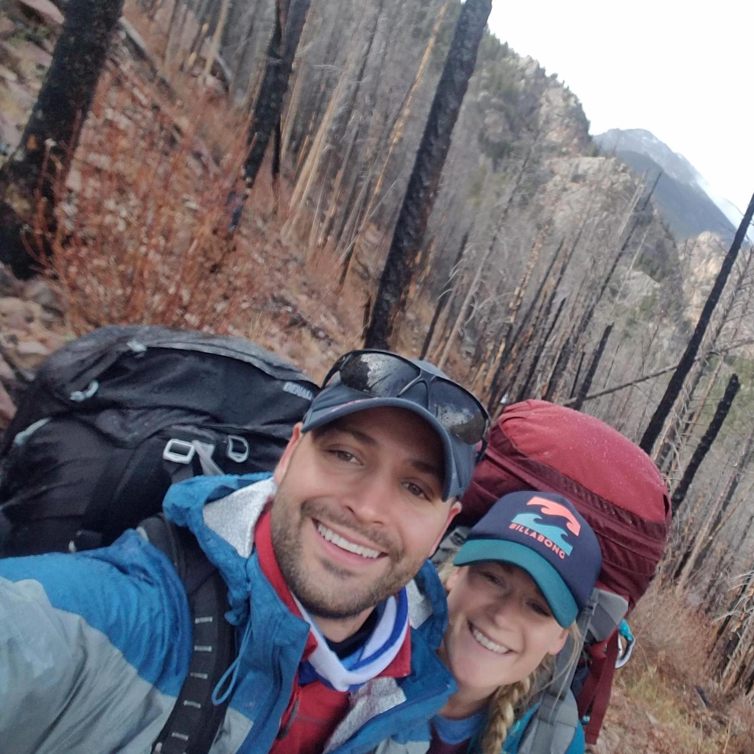 Our first trip together in Colorado - this was taken during a HUGE climb carrying our HUGE backpacks but we are still smiling (just)!