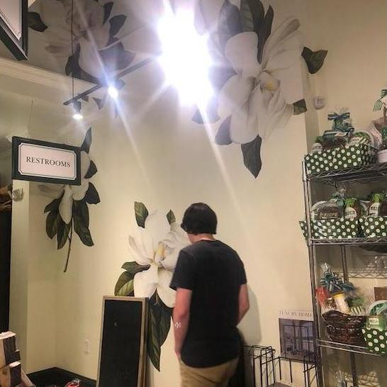 One day, we went to Reid's Fine Foods and Elizabeth told Sam she loved the magnolia decals. Sam tracked down the manufacturer and now they are on the living room wall!