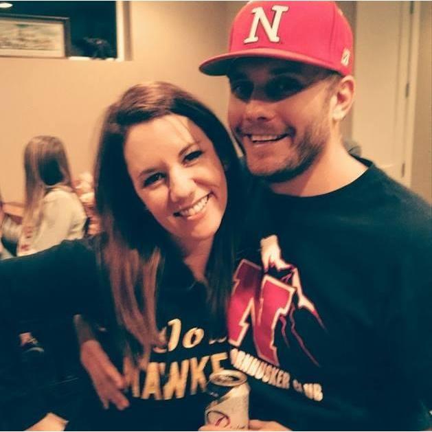 Nothing says "true love" like rooting against the rival team. She's an Iowa Hawkeye, he's a Nebraska Cornhusker. This will never NOT be an interesting combination!