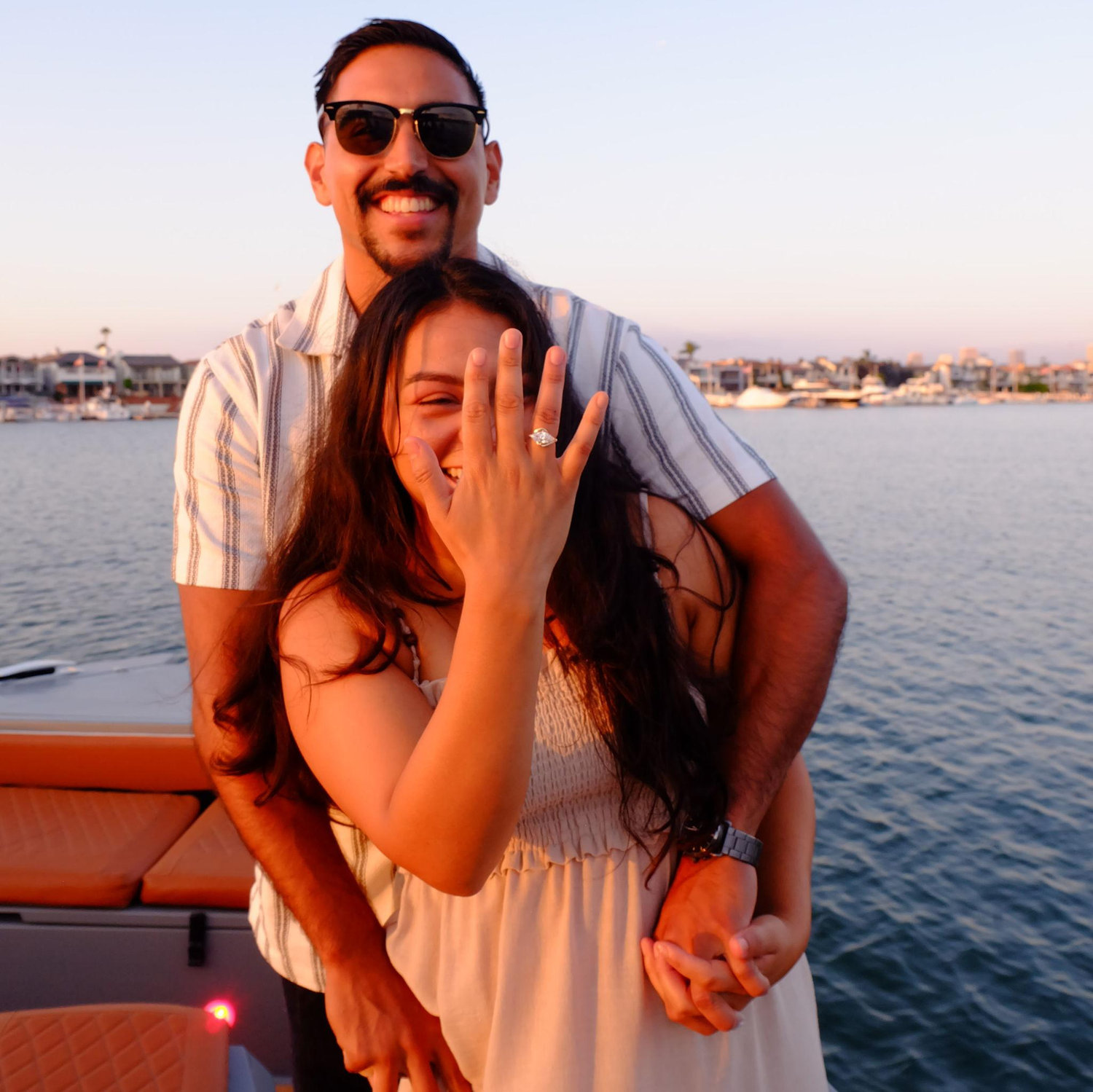 Caught somewhere between laughter and happy tears, Delma held up her hand and yelled, ‘I’m engaged!’
