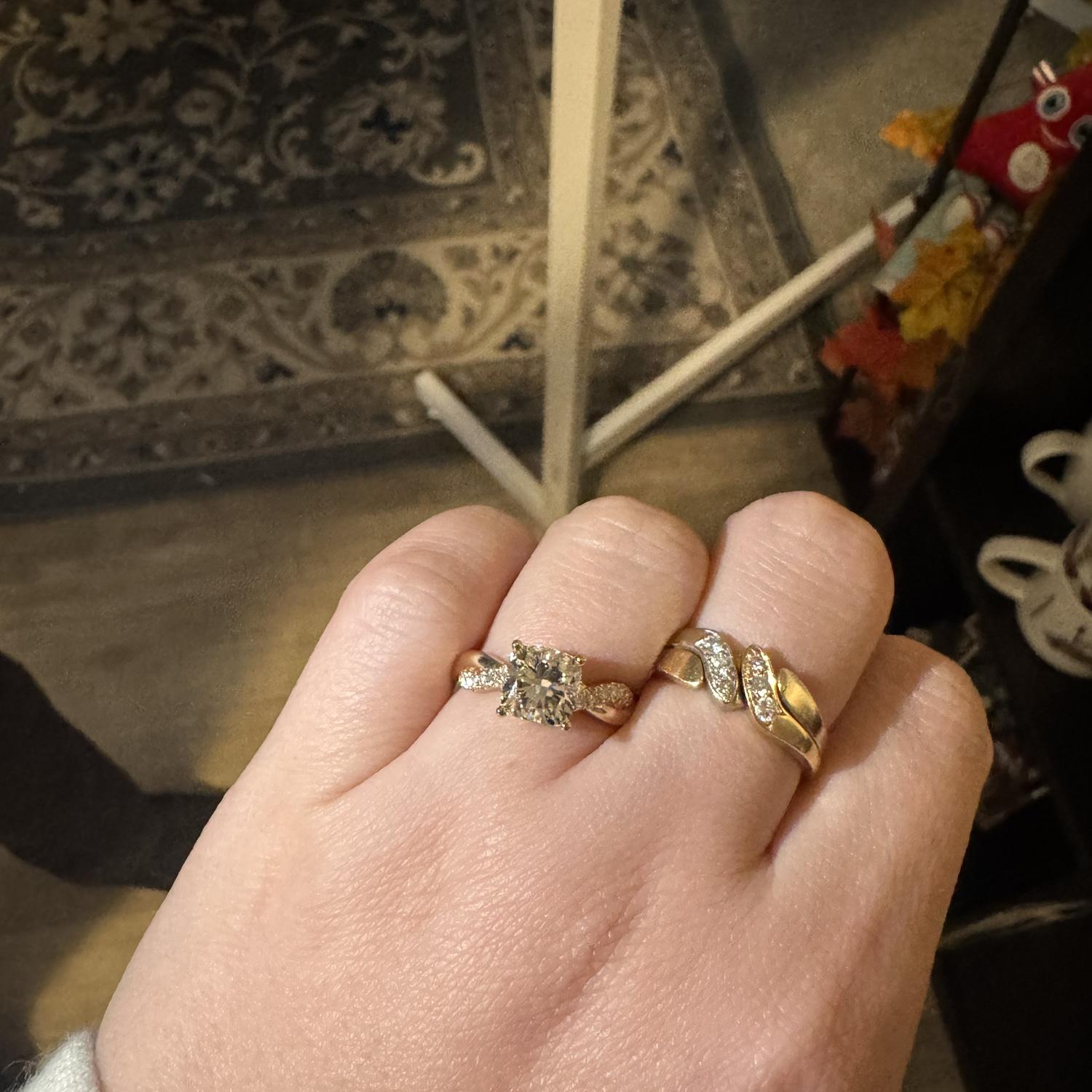 The ring made it safely on Audélia’s finger. 
Doug has 3 siblings and Audélia too. The twist in each side has 6 little diamonds representing every member of the Szulman Rich families.