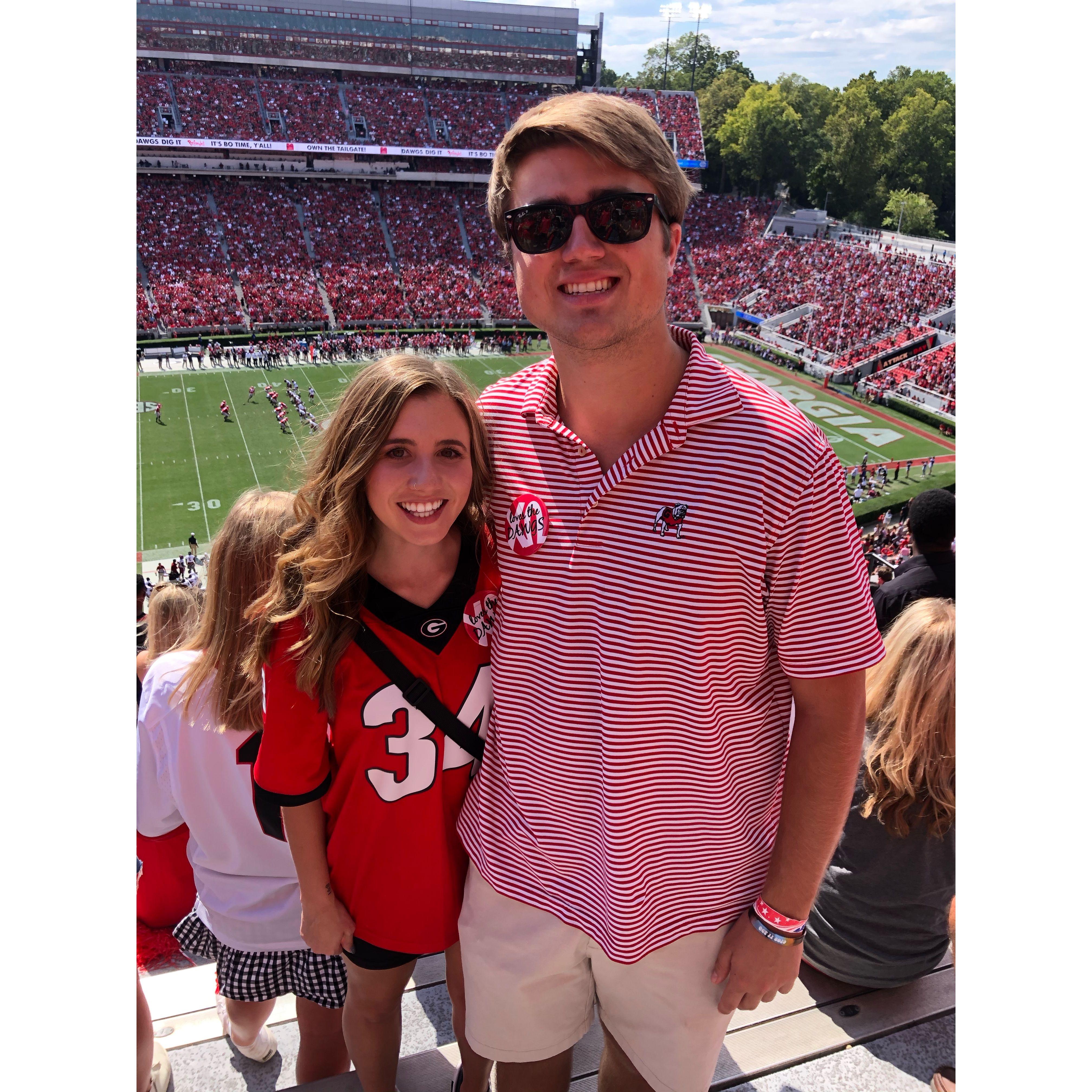 Cheering on the dawgs together sophomore year