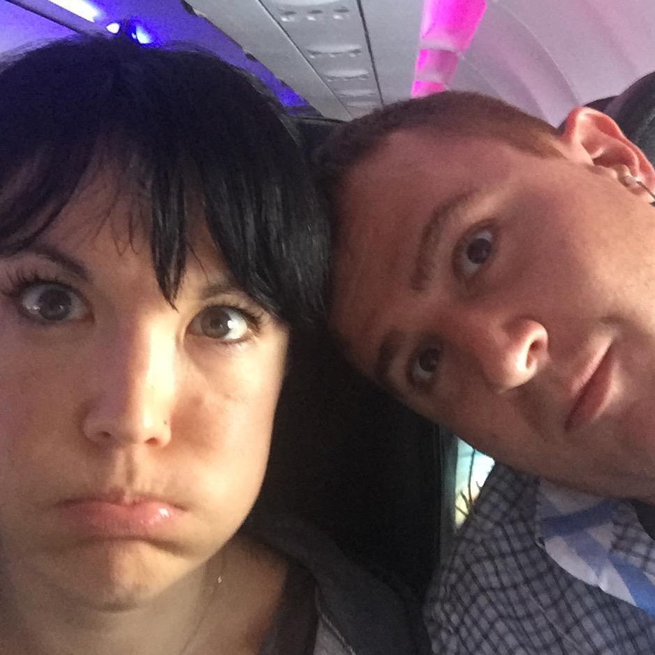 We make silly faces on planes. (check out the pink & purple untz untz lights in the background!)