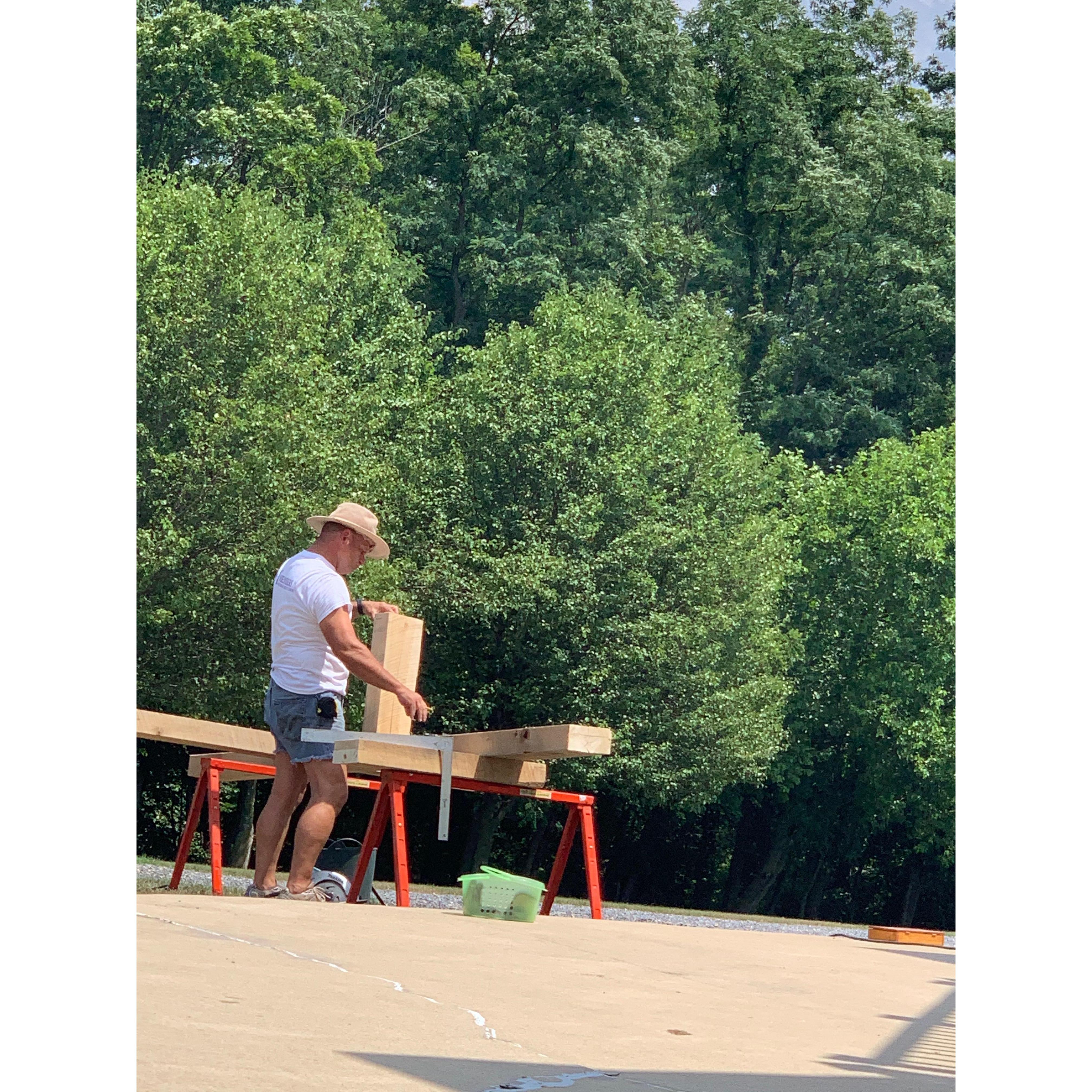 Brian building the cross for the ceremony.