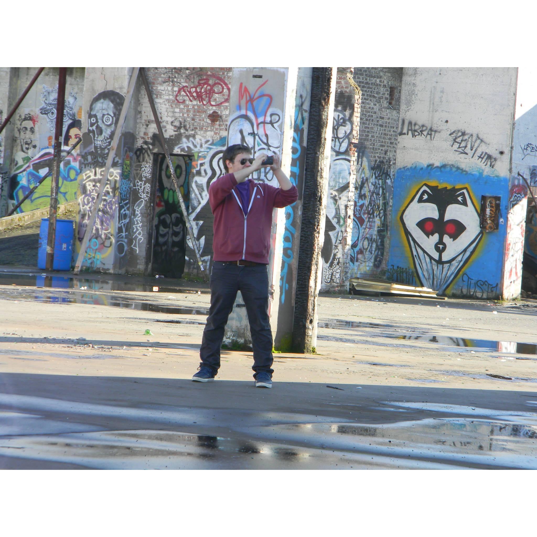 Chris on our first date. We snuck through the fence at Taylor Electric to take pictures of the art.  Who knew 4 years later he would propose here!? (Jan. 2015)