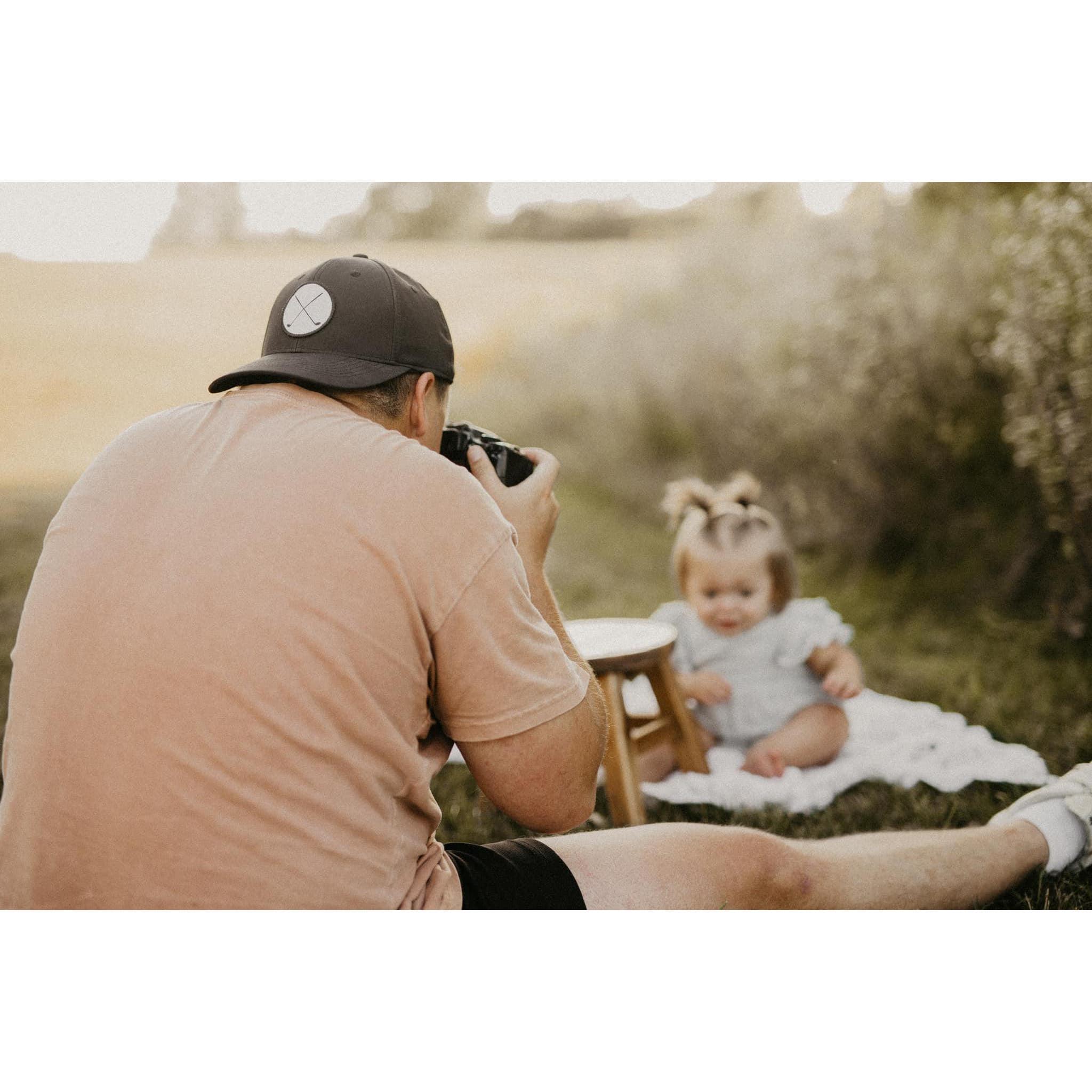 We both have such a passion for photography, I snapped this picture of grant taking Elises 1 year old photos!