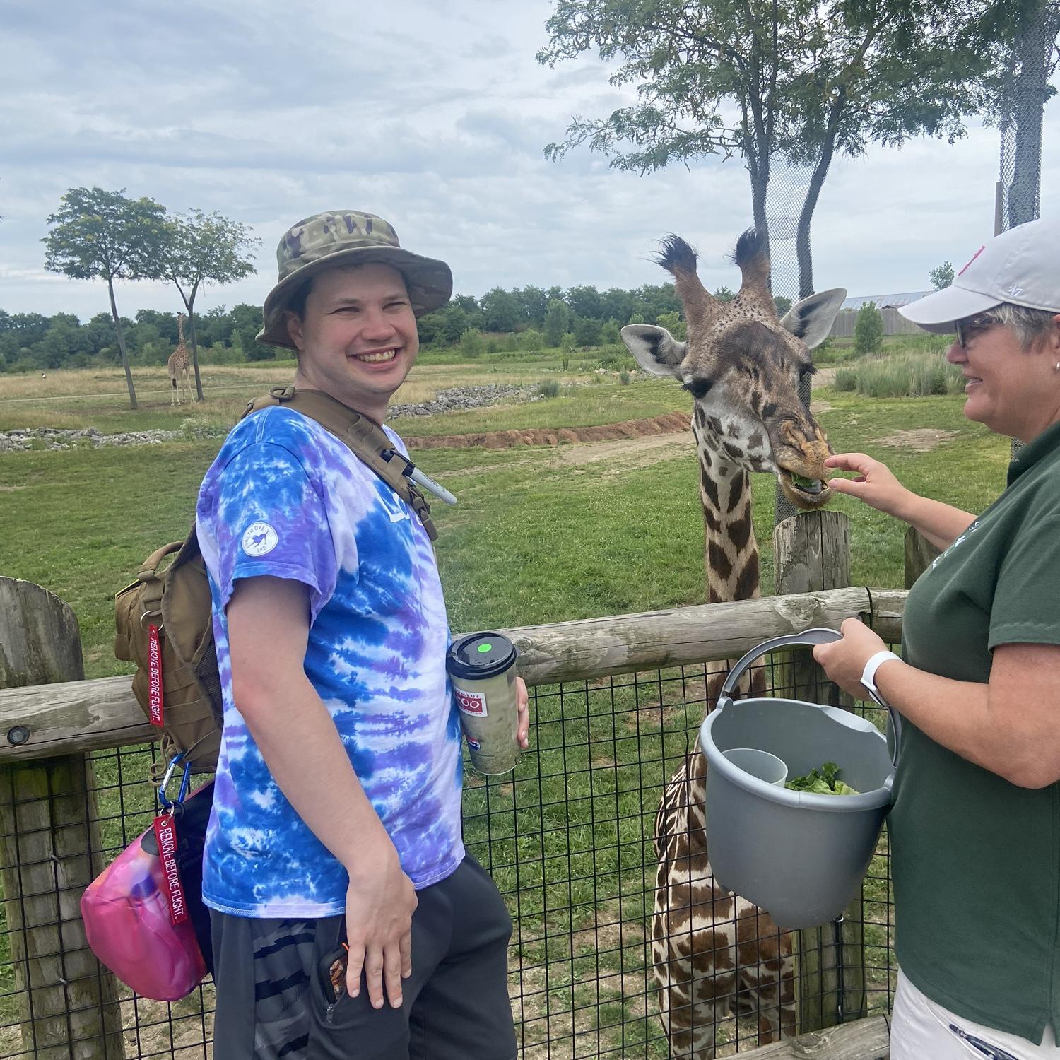 James feeding "James" the giraffe