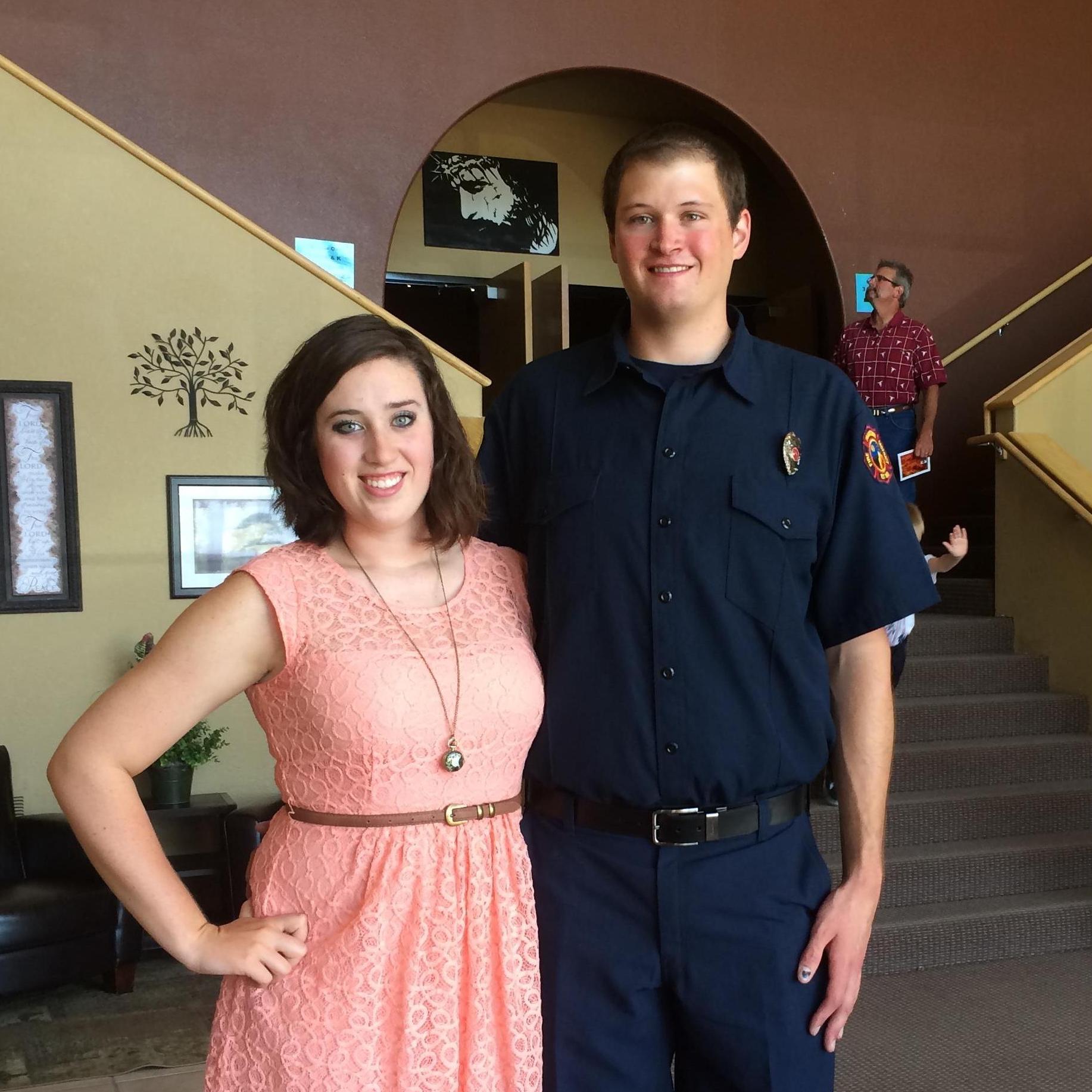 Brandon graduating from the Fire Academy.