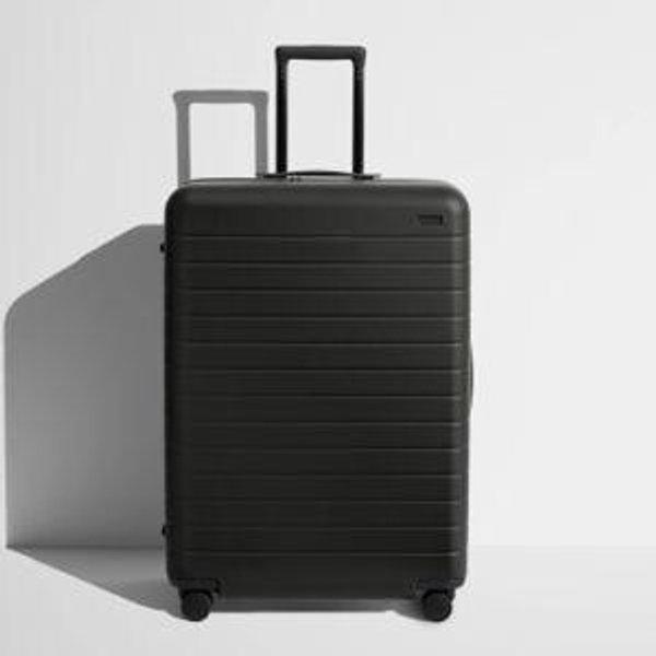 Shop Large & Checked Suitcases in Jet Black | Away