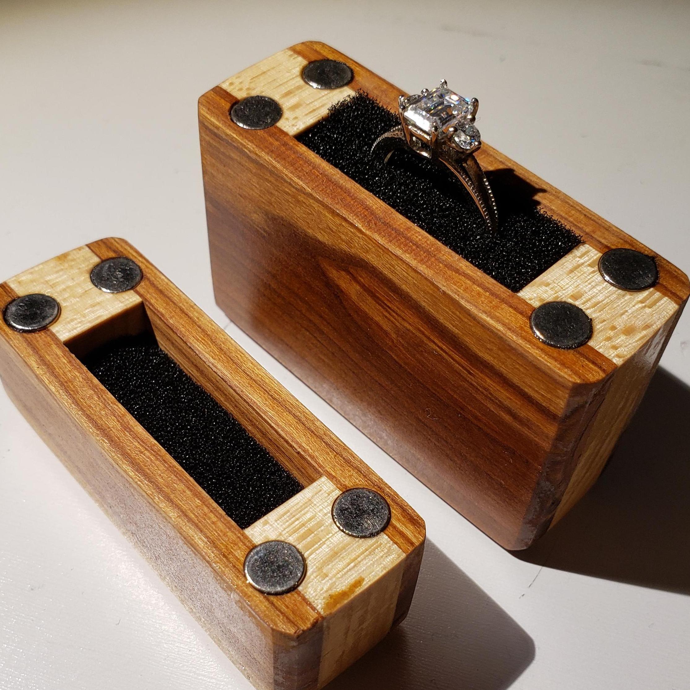 Scott and Jon worked together to make the ring box from maple wood and plum wood from a tree that used to grow at Andrea's childhood home in Fort Collins.