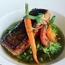 Salmon: Citrus Sauce, Spinach Orzo Pasta, Roasted Cherry Tomatoes, Baby Vegetables and Seasonal Sprouts