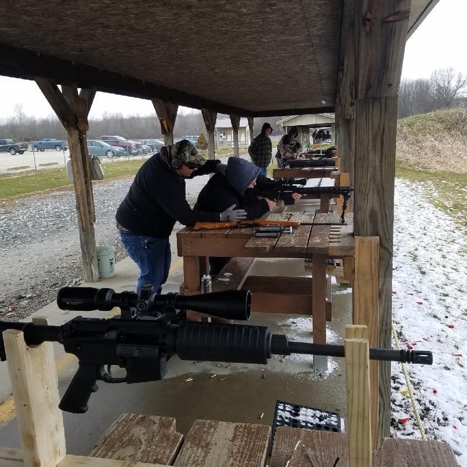 Teaching me how to shoot his gun