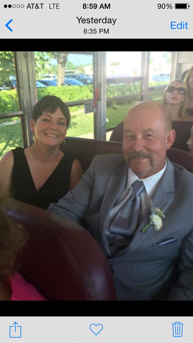 Aunt Donna & Uncle Duane on the yellow school bus. Further in the back is the Wedding Officiater looking cool in her shades