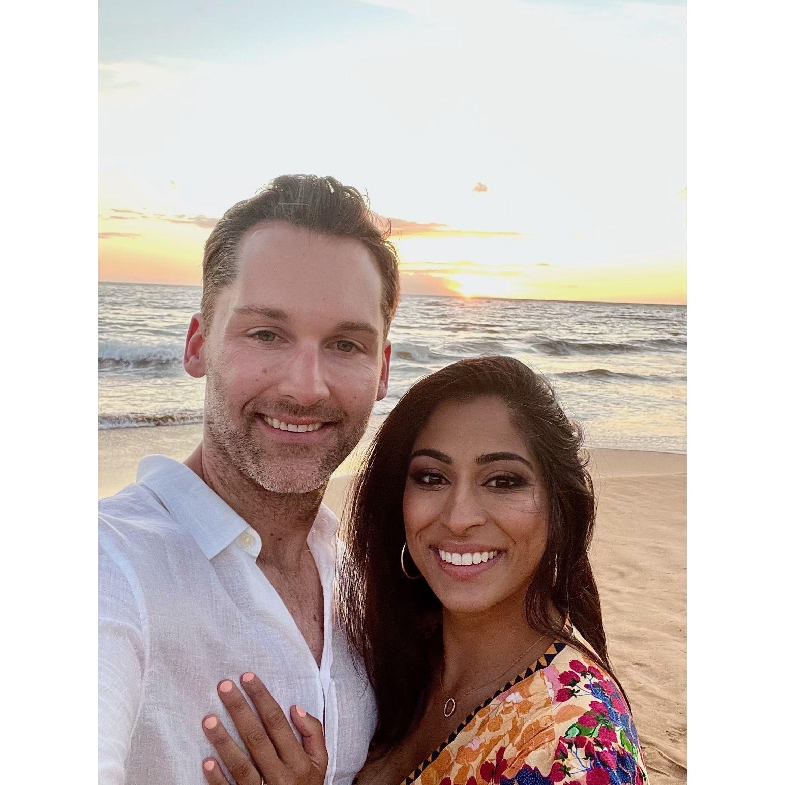 All smiles after getting engaged on the beach