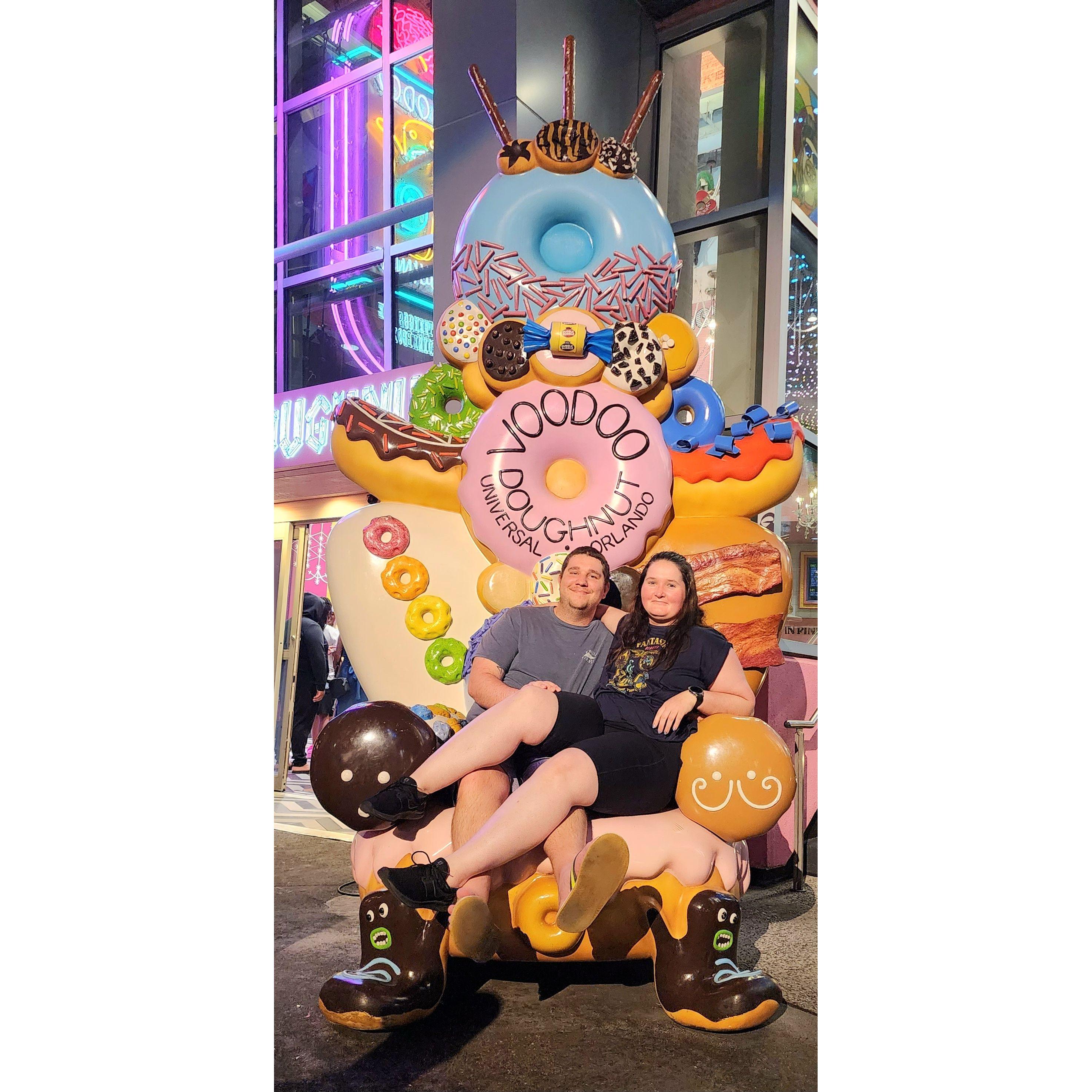 Us on the Voodoo donut chair at Universal FL 2023