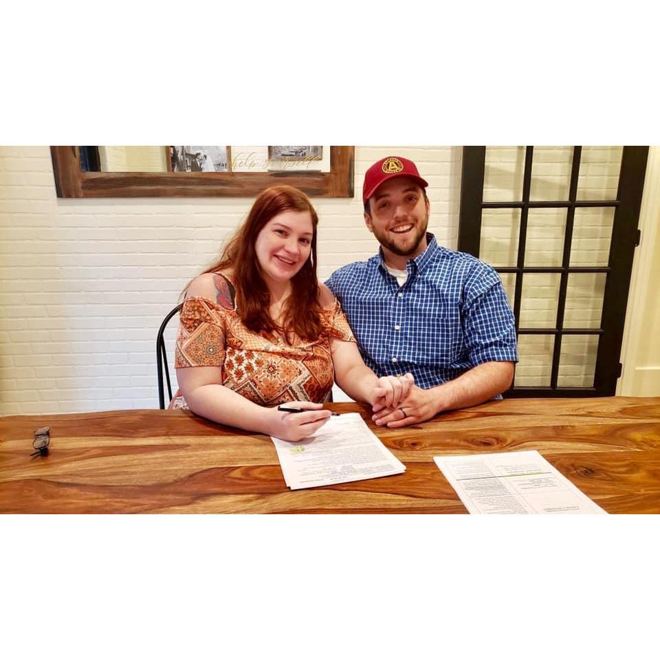 Signing the contract for our venue!