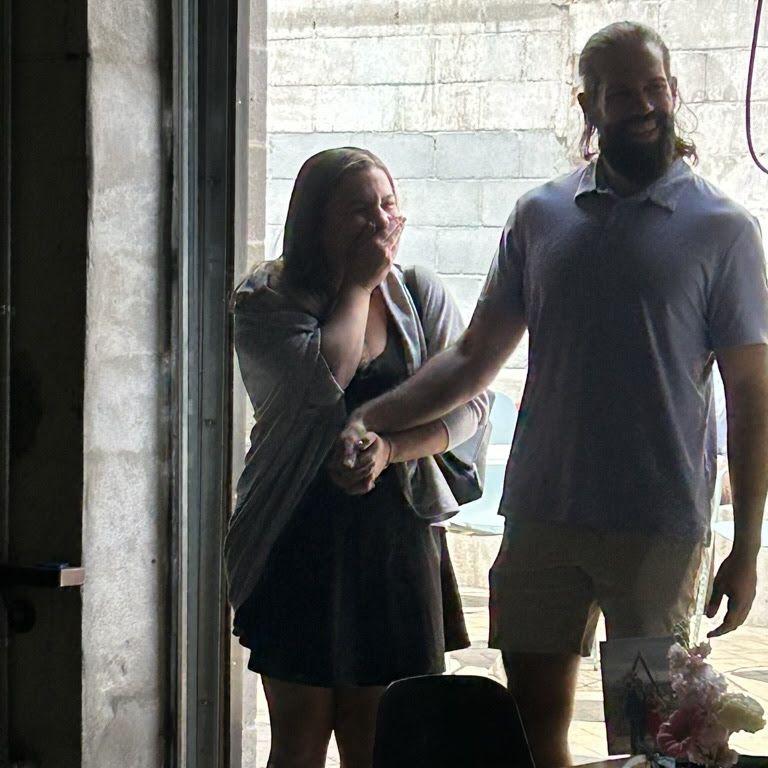The Big Surprise!! Abby and Danny walking into Trace Brewing after the engagement to friends and family!