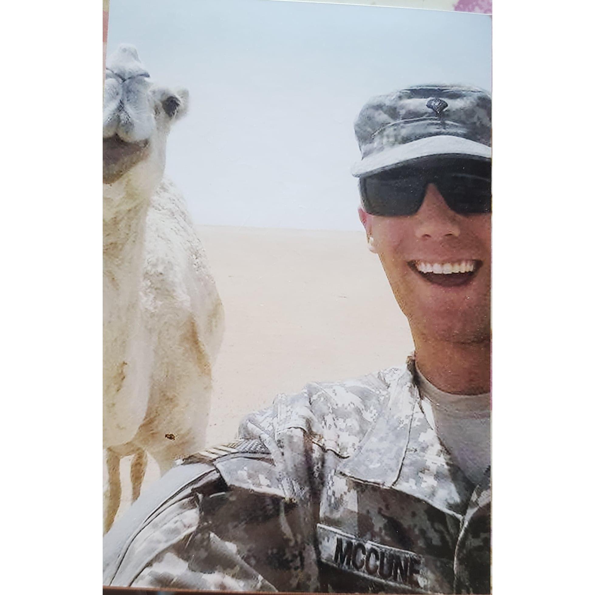 Keith serving in Kuwait, with his camel friend