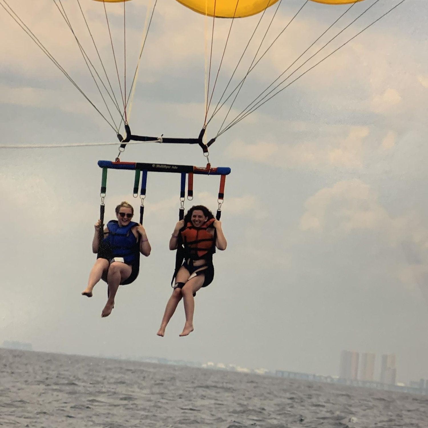 Bride and ft. Her sister and bridesmaid Lorilei going parasailing! That was an interesting time!