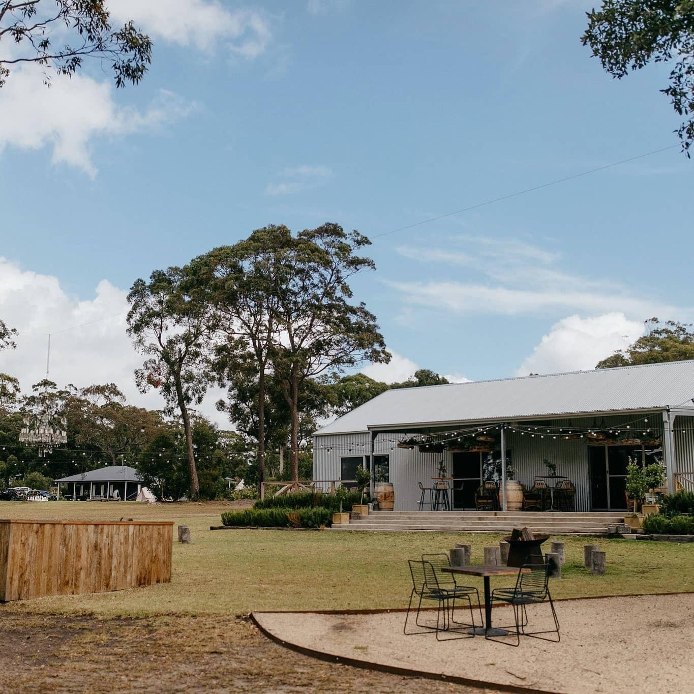 Reception Barn with outdoor bar, festoon lighting and fire pits.