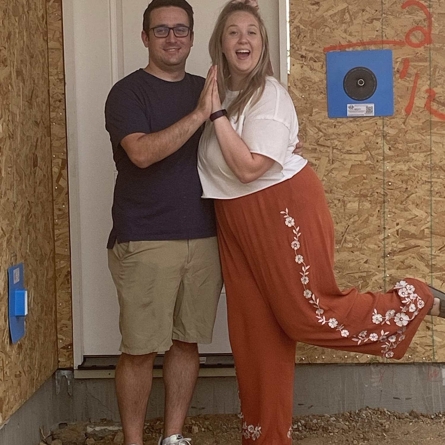 Brad & Amber Dawn in front of their first home, 2021