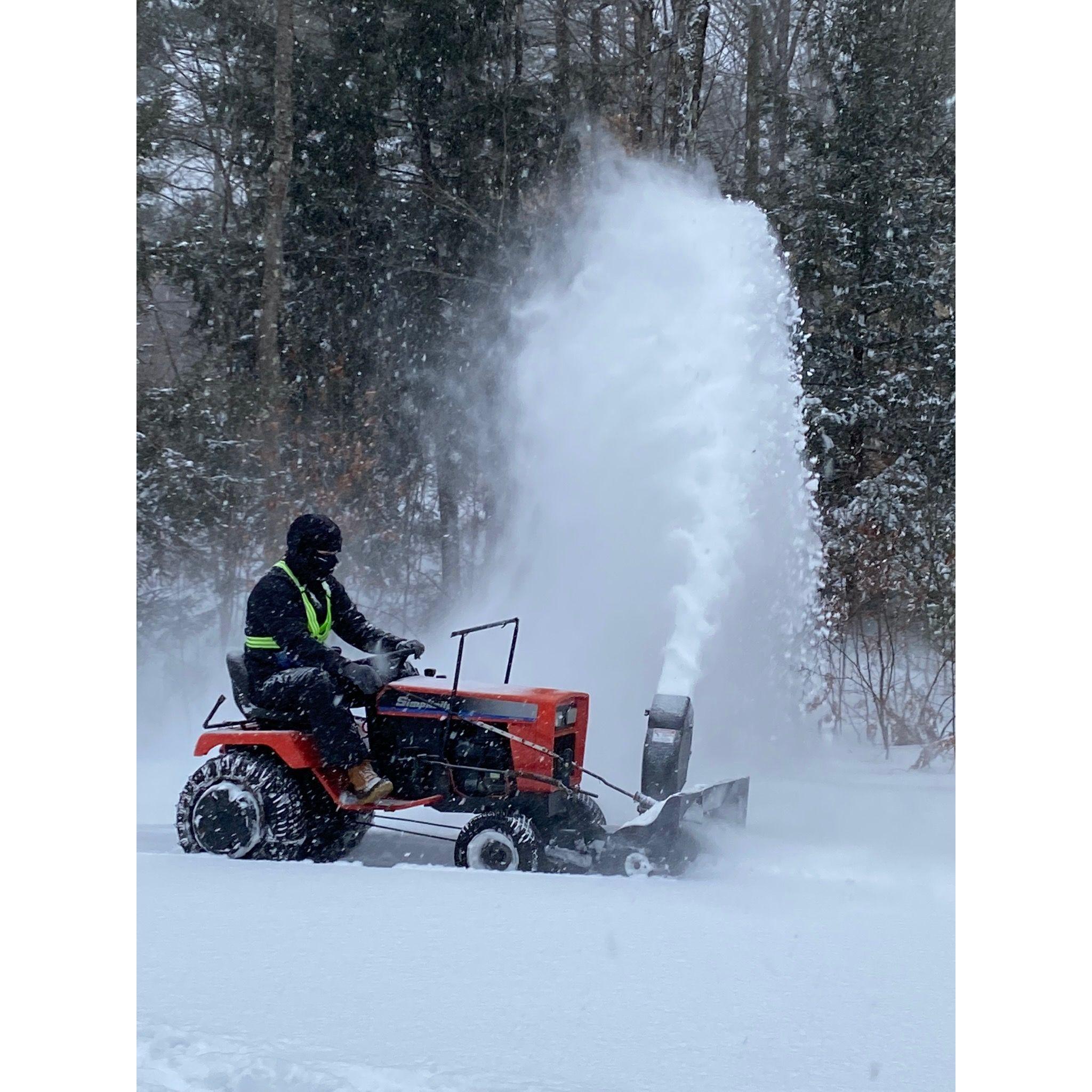 Marc on his trusty steed clearing the driveway
