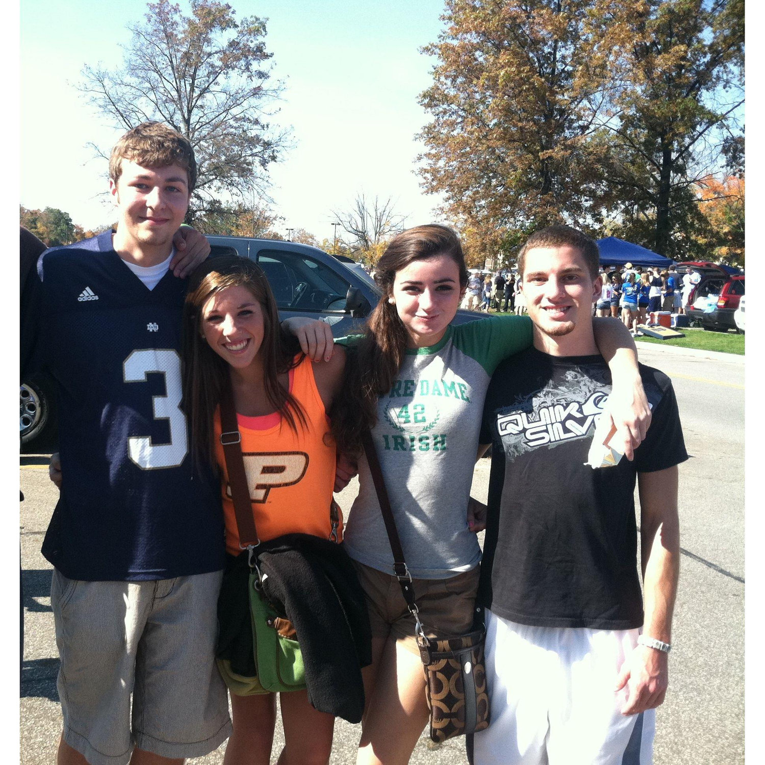 Our first photo together, 2011 - Notre Dame game, with Grace (a bridesmaid) and Ryan (a groomsman).